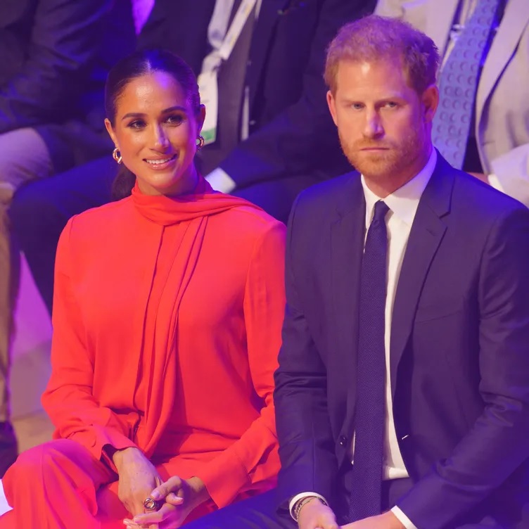 Meghan Markle performed a 'small love letter to Harry with her giggles, nose wrinkles and coy expressions' - but he looked 'much more ill at ease on his return to the UK', claims body language expertMeghan Markle performed a 'small love letter to Harry with her giggles, nose wrinkles and coy expressions' - but he looked 'much more ill at ease on his return to the UK', claims body language expert