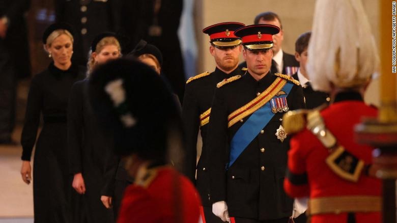 Princes William and Harry lead somber vigil by Queen's coffin