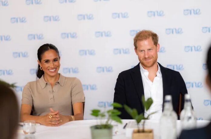 vMeghan Markle 'steps away' from Prince Harry in major money-making career move